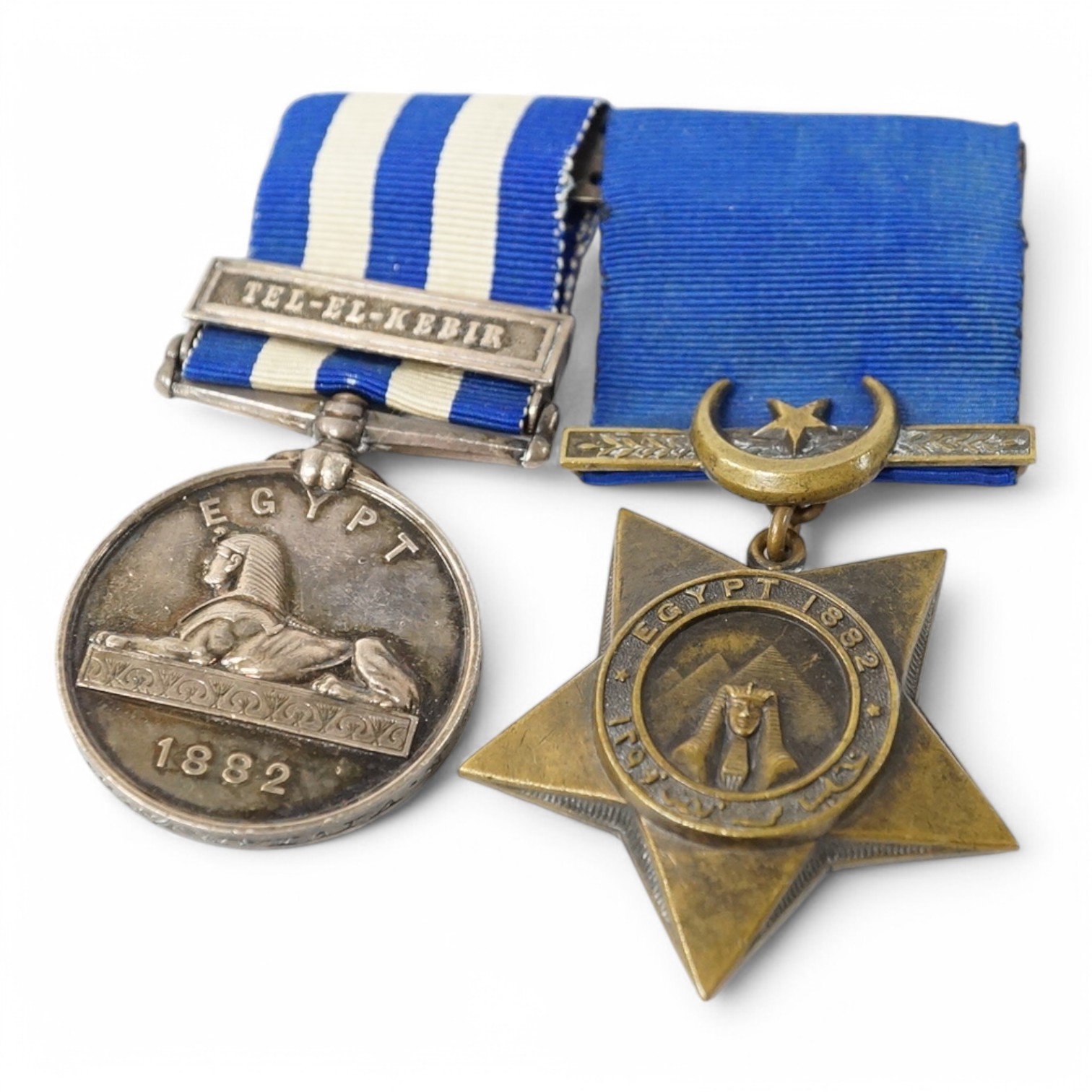 A Queen Victoria medal pair comprising an 1882 Egypt Medal and an Egypt Star, awarded to Lieutenant Colonel R. Vivian, engraved in italicised uppercase script. 1st Scots Guards. Condition - fair to good.